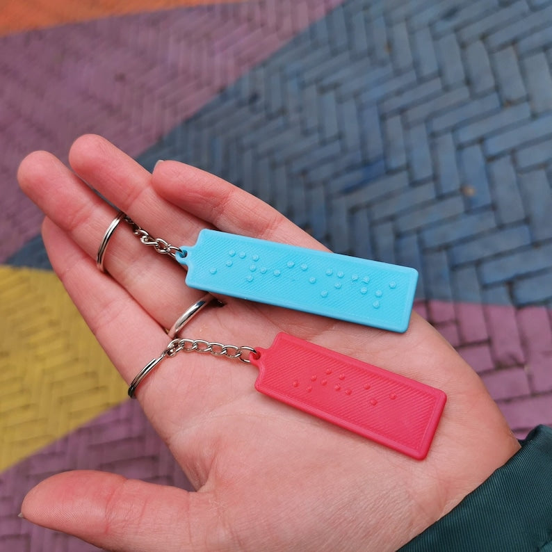 Key ring with the 6 braille dots on it